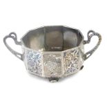 A white meta and niello white metal bowl, octagonal designed with shaped handles, with niello floral