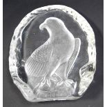 A glass paperweight, with an intaglio design of an eagle on rock, 15cm high.