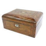 A Victorian walnut sewing box, with a domed top, inlaid with mother of pearl and boxwood strung, wit