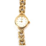 An Accurist gold lady's 9ct gold wristwatch, with circular watch head, on V splayed strap, 16cm long