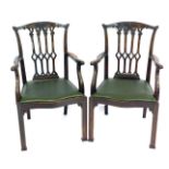A pair of 19thC Gothic Chippendale style carver chairs, with drop in seats, 63cm wide.