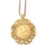 An Edward VII full gold sovereign pendant and chain, the coin set in a 9ct gold scroll design pendan