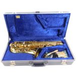 A Boosey & Hawkes 400 cased saxophone, with additional mouthpieces, the case 63cm wide, 28cm deep.