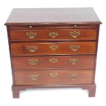 A George III mahogany bachelor's chest, with brushing slide over for graduated drawers with brass pi