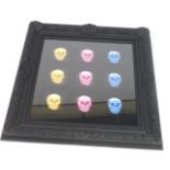 21stC School. Holographic pink, blue and yellow skulls, in an arrangement of three rows of three, 96