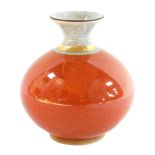 A Royal Copenhagen globular vase, with crackle glaze in orange, white within gilt borders, printed m