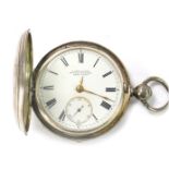 A Victorian silver hunter pocket watch, with plain silver case opening to reveal a white enamel dial