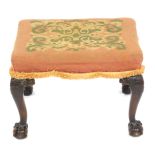 A Chippendale style mahogany stool, with cabriole legs, ball and claw feet, and wool work top, 58cm