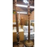 Two carved hardwood standard lamps.