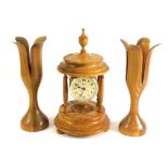 A lightwood Hermle quartz clock garniture, comprising clock with 8cm diameter Arabic dial, suspended