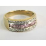 A 9ct gold pink topaz and cz dress ring, the central bar set with eight pink topaz stones, with two