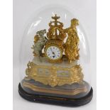 A 19thC gilt metal mantel clock, the 8cm diameter Roman numeric dial flanked by goat and classical f