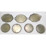 Various silver plated ware, a set of four partially chased serving plates or dishes, each of circula