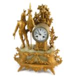 A 19thC gilt metal mantel clock, with figure of soldier aside 8cm diameter Roman numeric dial with e