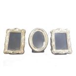 A pair of Elizabeth II miniature silver fronted photograph frames, each with velvet lined easel back