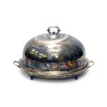 A 19thC silver plated meat cover, of large proportion, the domed lid with shaped scroll handle, on o