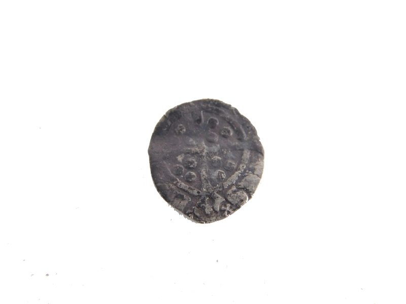 A Henry VIII style half penny type coin.