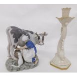 A 20thC Copenhagen B&G figure of a milkmaid and cow, number 2017, printed marks beneath, 20cm high,