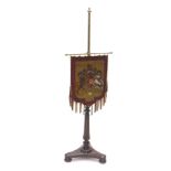 A 19thC rosewood pole screen, the brass cylindrical top with a later embroidered lion and unicorn pe