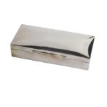 A George V silver cigarette box, by Mappin and Webb, with shaped lid, thumb mould handle, cedar line