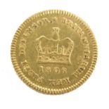 A George III gold 1/3 guinea.