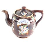 A Bargeware treacle glazed pottery teapot, raised with flowers marked Mrs J G May, Stanton Hill, Not