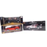 Three various boxed Maisto and other diecast cars, to include Mustang SVT Cobra, 23cm wide, etc. (a