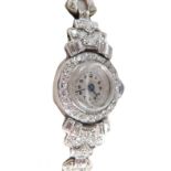 An Art Deco design ladies cocktail watch, with silver Arabic dial, blue hands, diamond set bezel and