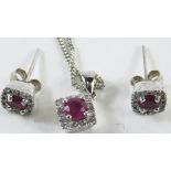 An 18ct white gold ruby and diamond necklace and earring set, with square studs with central emerald