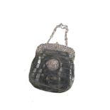 An early 20thC leather evening purse, with white metal mounts and central initial, unmarked, 16cm wi