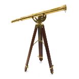 A modern Stanley London 1885 model brass telescope, on a wooden and brass tripod stand, 102cm long.