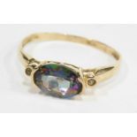 A mystic topaz dress ring, set with oval central stone, with tiny diamond set shoulders, raised bask