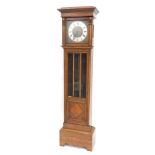 A 20thC oak cased longcase clock, the silvered 22cm diameter chapter ring with Roman numeric dial, w