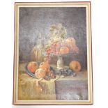 20thC School. Still life, fruit and bottle on a table, oil on canvas, unsigned, Frank Gadsby label v