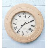 A modern pine cased Tempus Fugit battery operated wall clock, with Roman numeric dial and baton poin