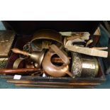 A trunk containing various metalware, hand bell with turned wooden handle, part lantern clock, coppe