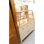 Two beech dining chairs and a part painted kitchen side cabinet.