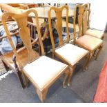 A set of four walnut Queen Anne style dining chairs, with hour glass splats and drop in seats, on ca