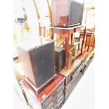 A music system with Sharp stacking system, in wooden cabinet, two speakers in wooden cabinet, radiog