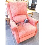 An electric reclining chair in red material.