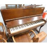 A Holder upright piano, with plastic keys.