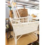 A Lloyd Loom style crib, painted chair and a wicker basket.