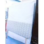 A memory foam Tempur double mattress and striped headboard.