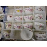 A Victorian part tea service, decorated with flowers, and other associated cups. (1 box)