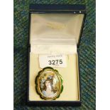A TLM Gainsborough style gold plated brooch, with green enamel finish outline, set with portrait of