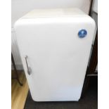 A vintage LEC fridge, in white with raised blue medallion and part fitted interior. WARNING! This lo