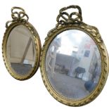 A pair of early 20thC gilt wood mirrors, each with a ribbon moulding with a bead outline and bevelle