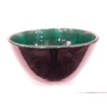 Peter Moss (b.1940). A pottery crackle glaze bowl, in green lustre and black, on circular foot, mark