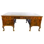 A mahogany partner's desk in George III style, the rectangular top with a brown leather inset and a