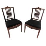 A set of ten late 19th/early 20thC mahogany dining chairs, each with a ribbon carved crest, a bar ba
